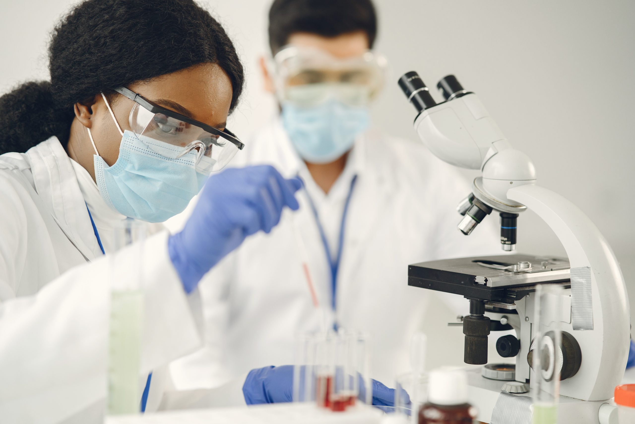 researchers creating vaccine for covid 19 in a lab